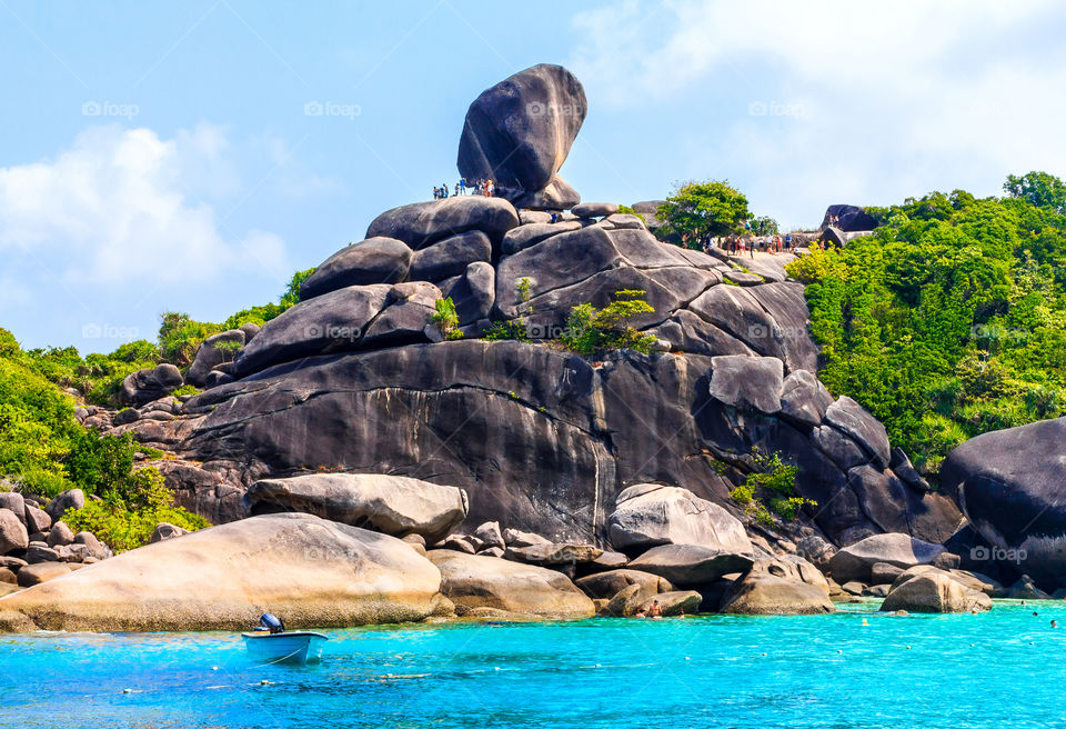 Tourist on boulders