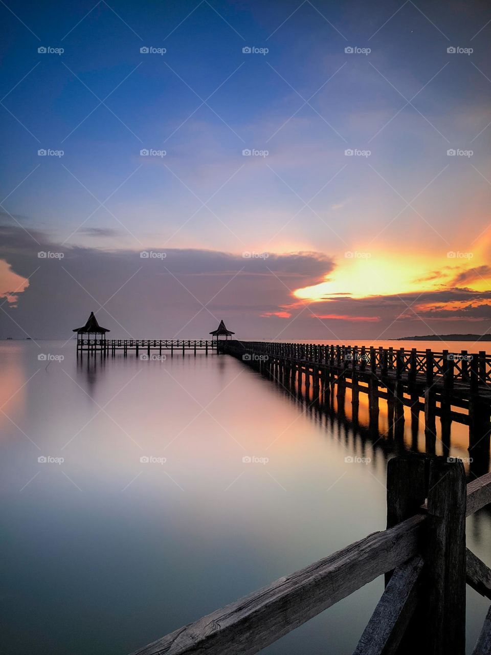 bridge and sunrise by the sea
