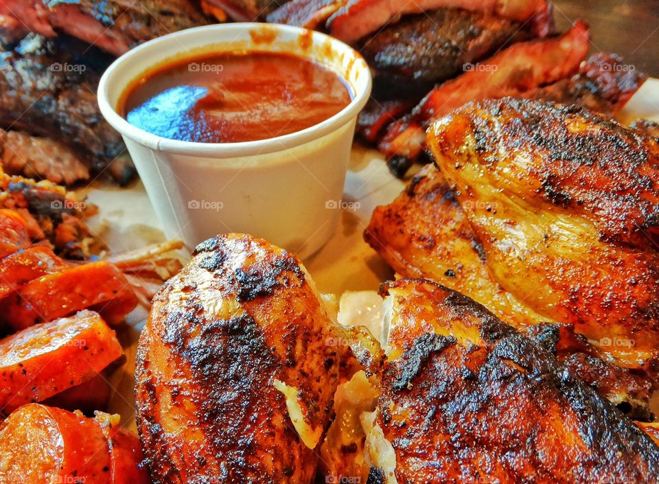 Barbecue Feast. Beef, Pork, And Chicken Served In A Texas Barbecue
