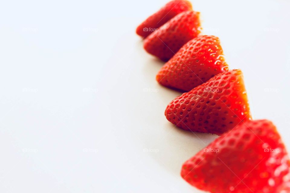 Strawberries lined up in a row