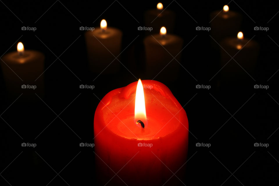 Candle. Minimalism. Red light. Fire