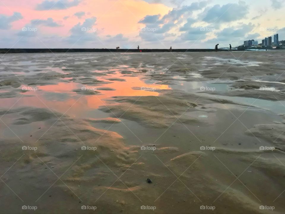 reflection of sunset on a brazilian beach