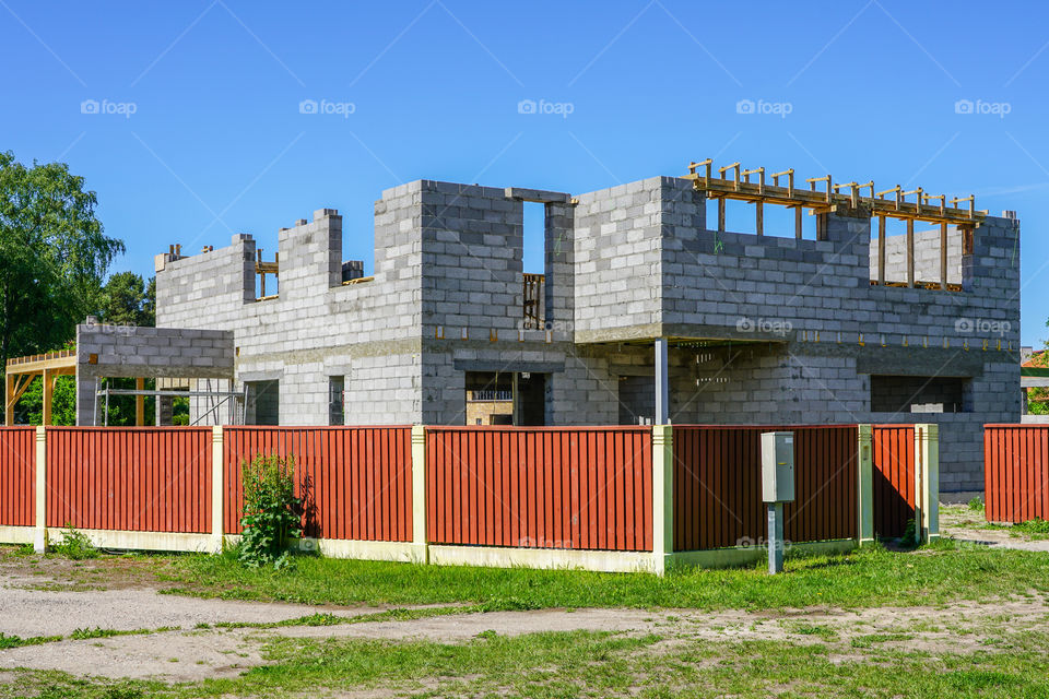 concrete foundation and wall construction of a new house, view of construction site in preparation proccess