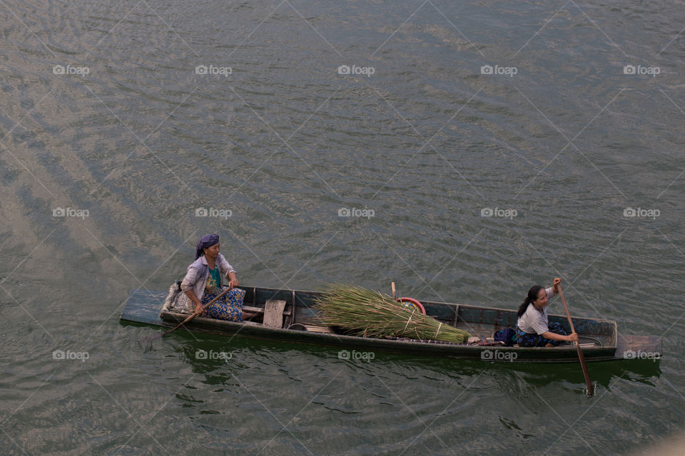 Villager on the boat in the river 