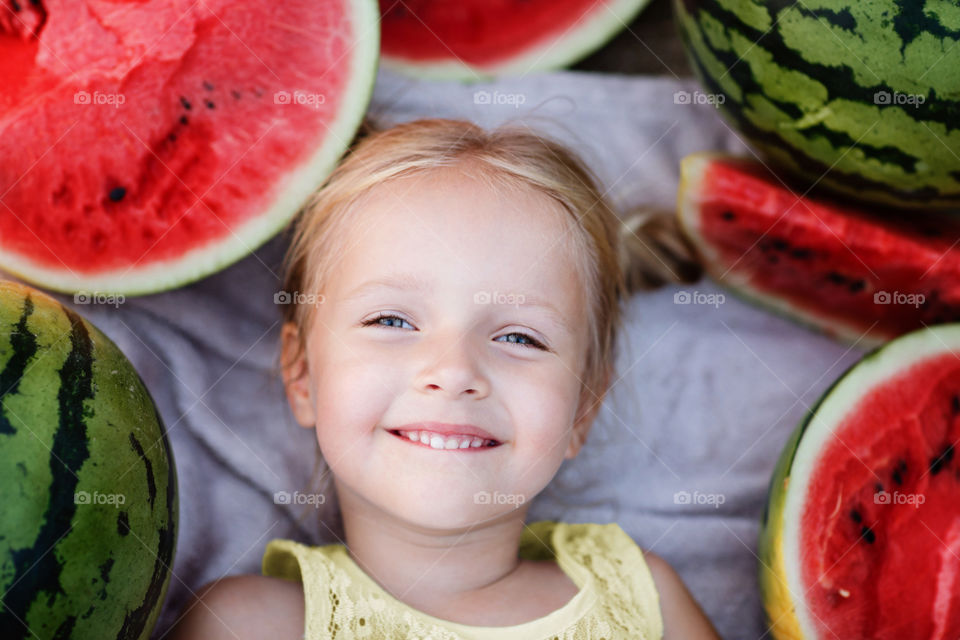 Girl and red watermelon 