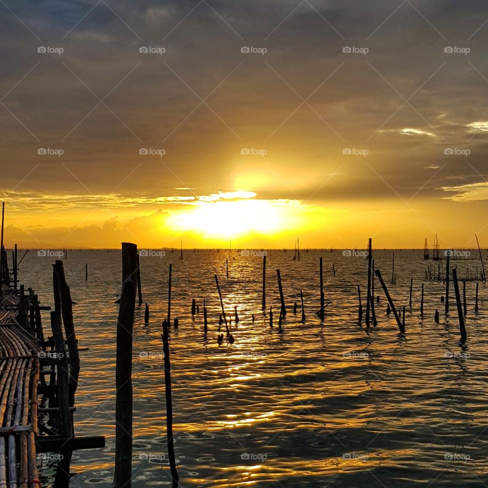 Scenic view of lake against sunset sky