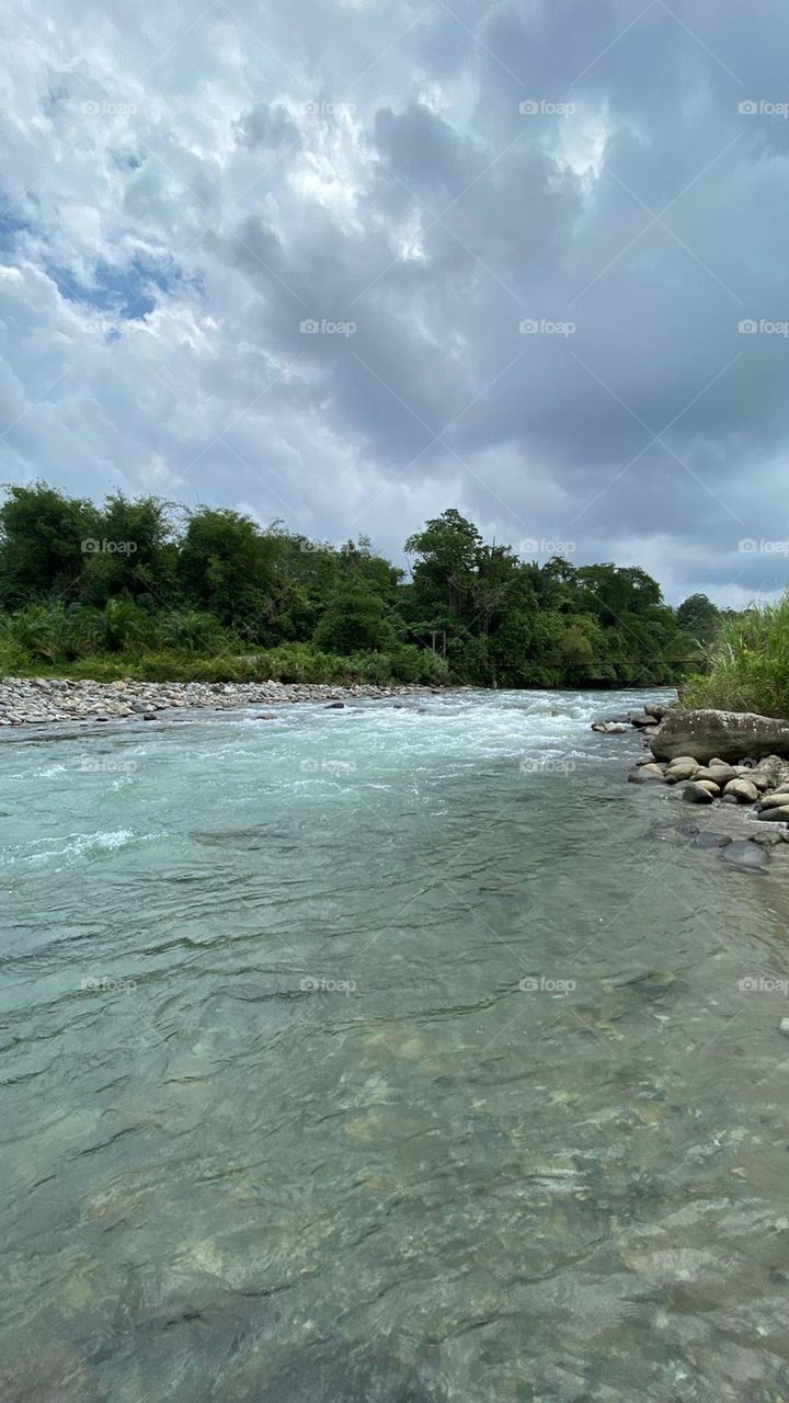 padang guci river with much stone and the cool water