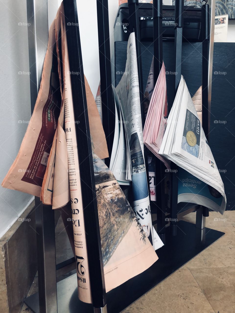 Newspaper rack in the hotel lobby
