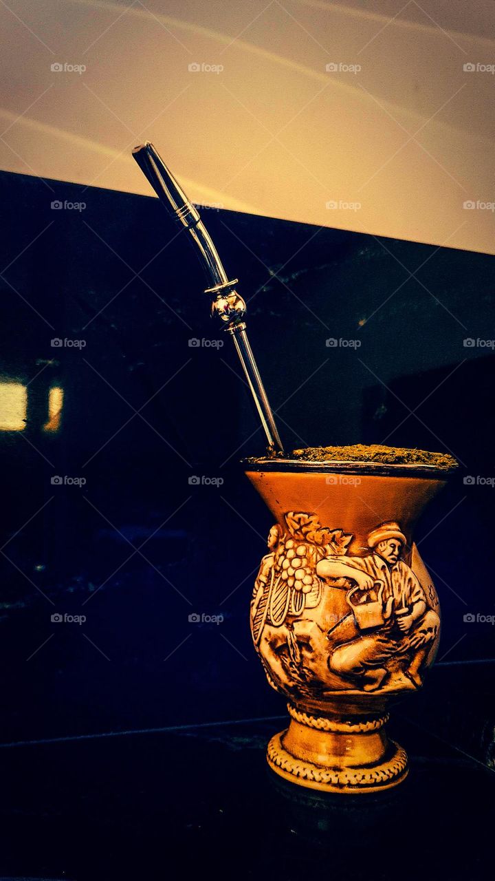 Chimarrão: Symbol drink of the State of Rio Grande do Sul, Brazil. Image of Cuia in Porcelain with the pump, yerba mate and hot water. Gourd and bomb in high relief containing images of the pampas man.