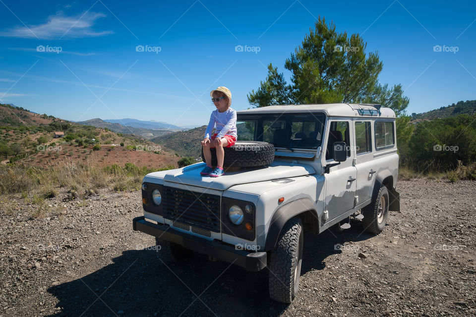 Little girl admiring the view from terrain car.
