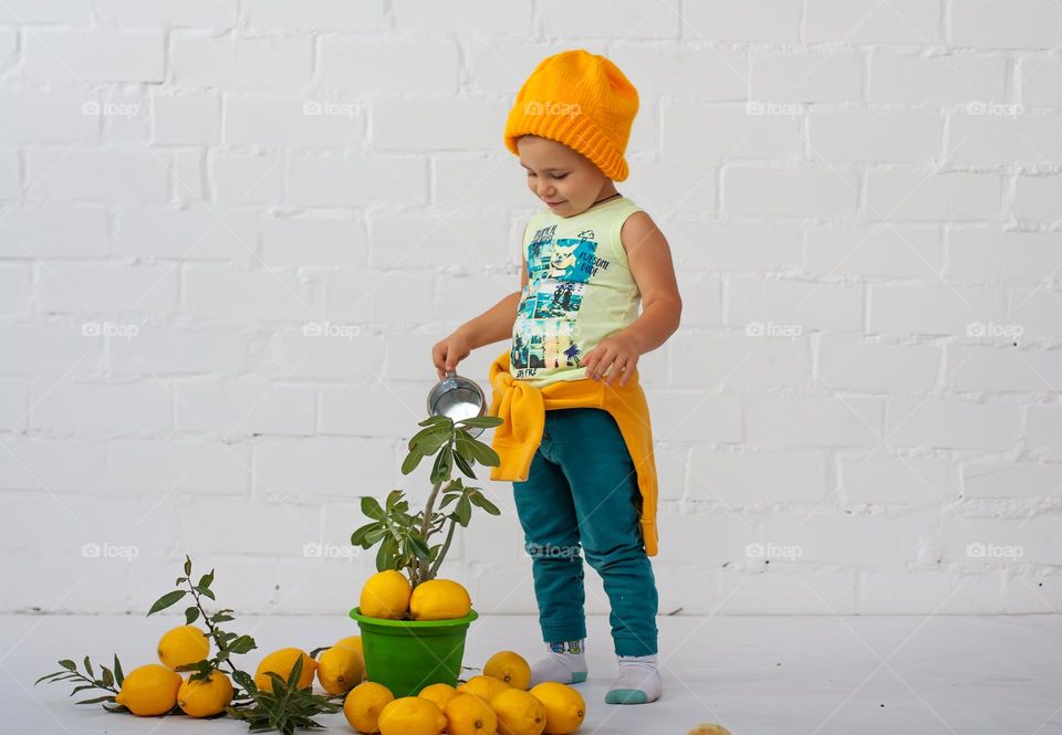 boy with lemons