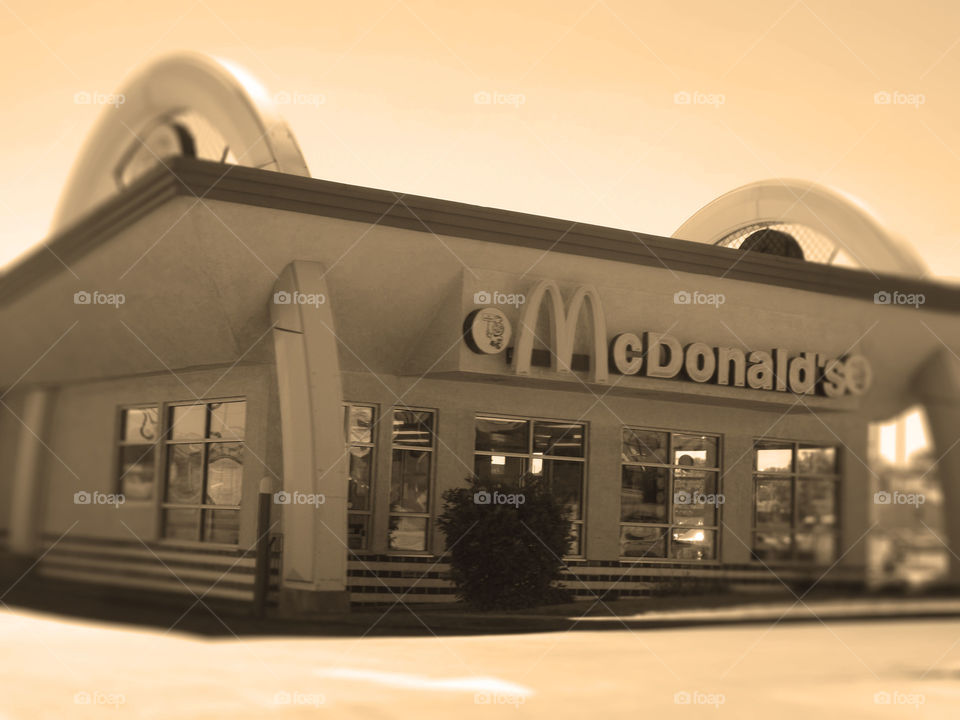 Retro 50's Style McDonald's, Mission, Kansas. I don't know if this is an old McDonald's or a newer one built in the style of the 1950's, but it's definitely different and cute. It's located on Johnson Drive in Mission, Kansas. I added a radial blur and sepia tone to enhance the retro look.