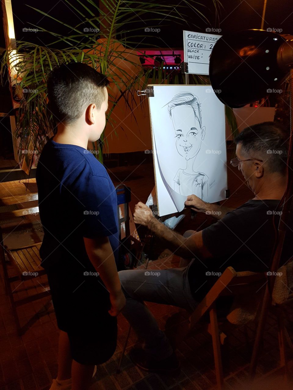 Tenerife evening Street entertainment,2016 caricature artist.