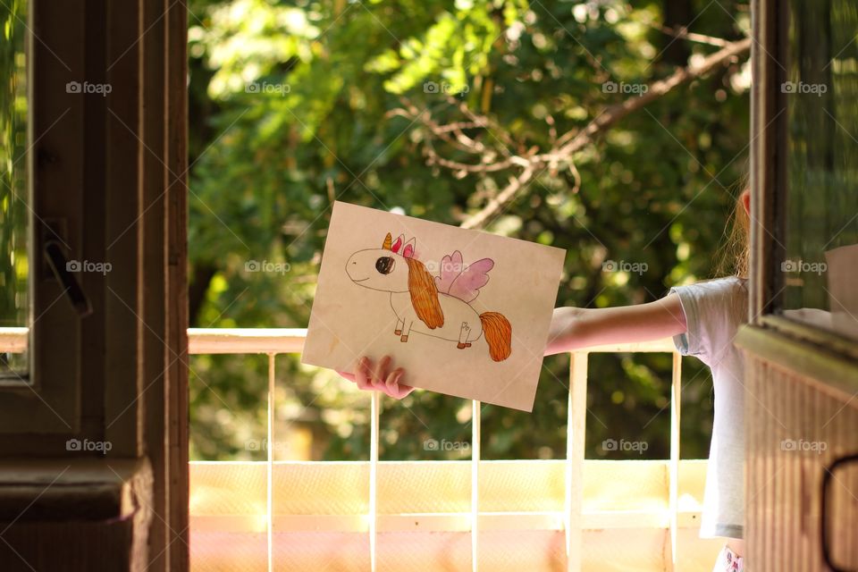 children's drawing in the summer on the balcony