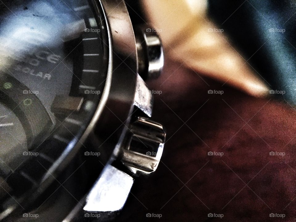 Macro close-up of solar wrist watch on male hand