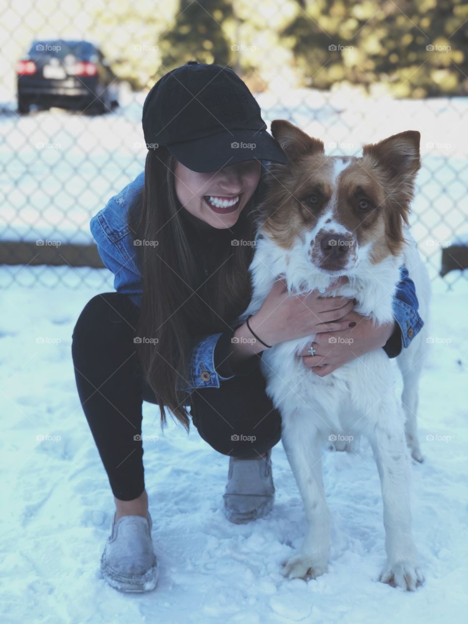 A girl and her furry best friend enjoying the snow.