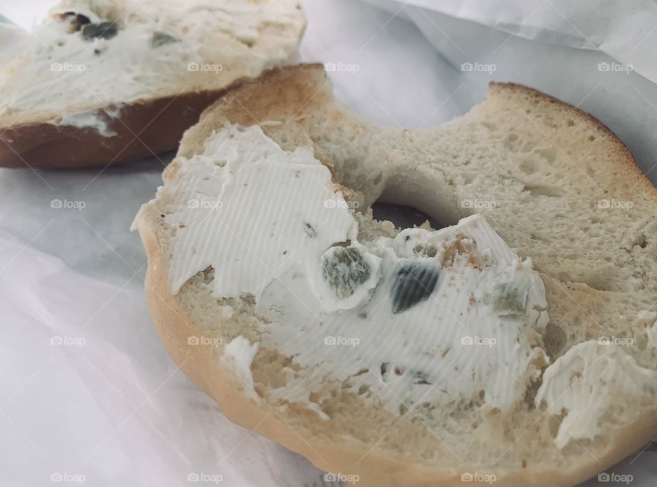Breakfast bagel with cream cheese and jalapeños 