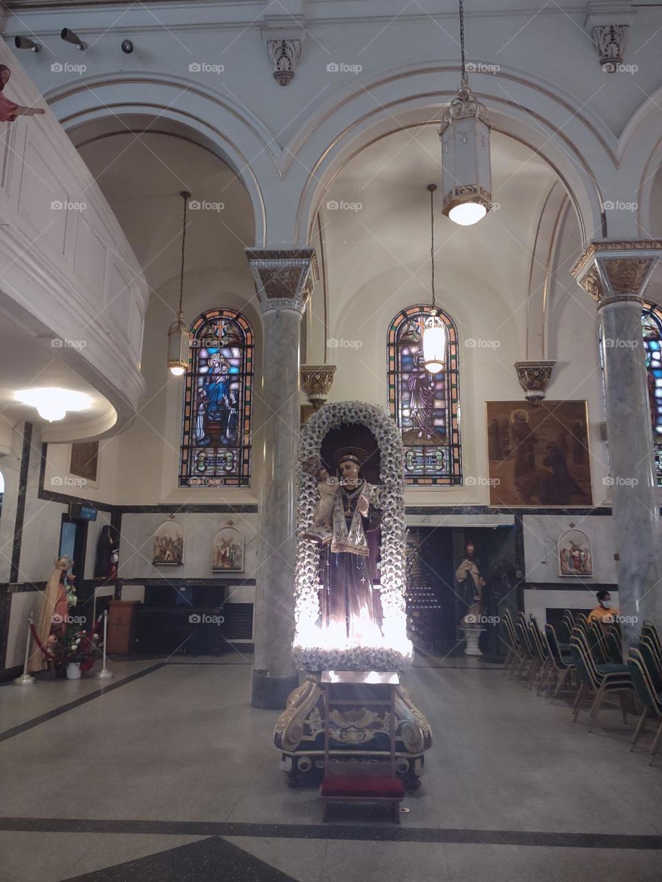 Statue of Saint Anthony holding Baby Jesus in it's own niche, enhanced with built-in electric lights