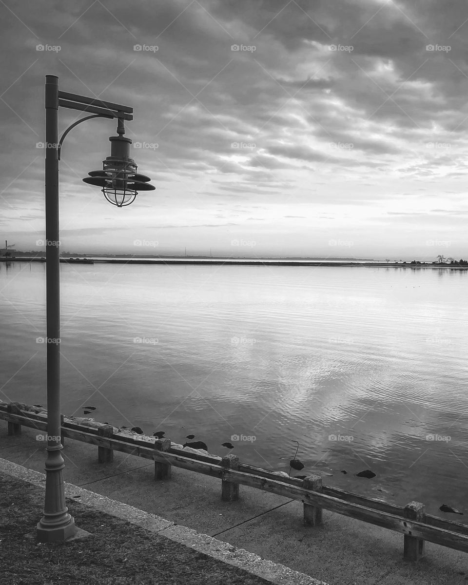 Black and white picture of clouds over water