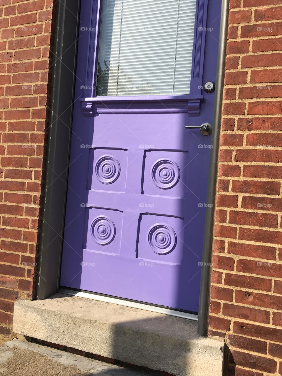 Visions of downtown, red brick, purple door 