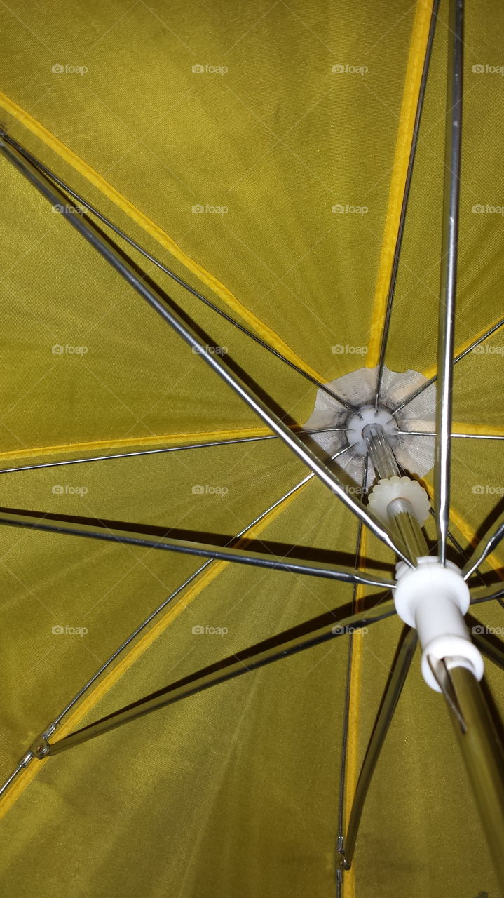 inside a yellow umbrella