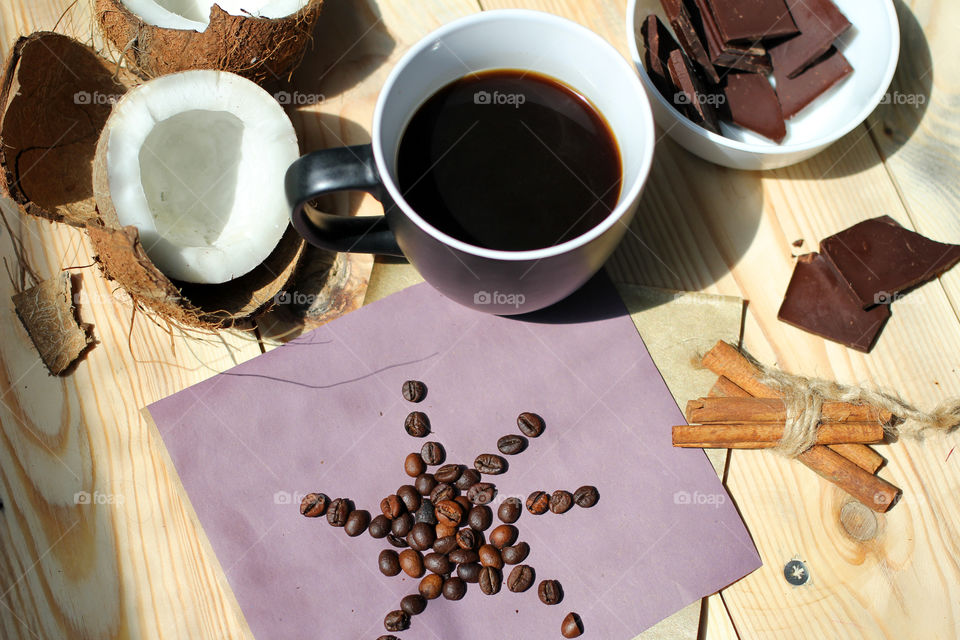 Coffee, hot drink, drink, grain, coffee beans, cinnamon, sticks cinnamon, lilac, flowers, purple flowers, bouquet, flowers in a vase, vase, coconut, chocolate, rest, morning, work, cafe, restaurant