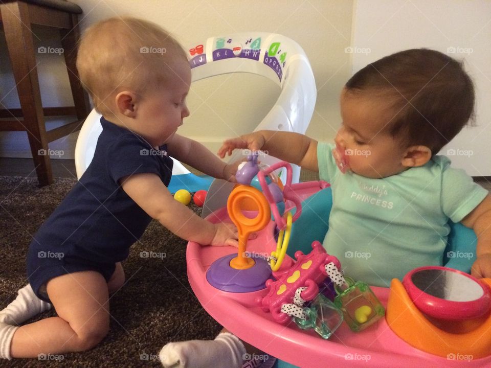 Baby girls playing with each other 