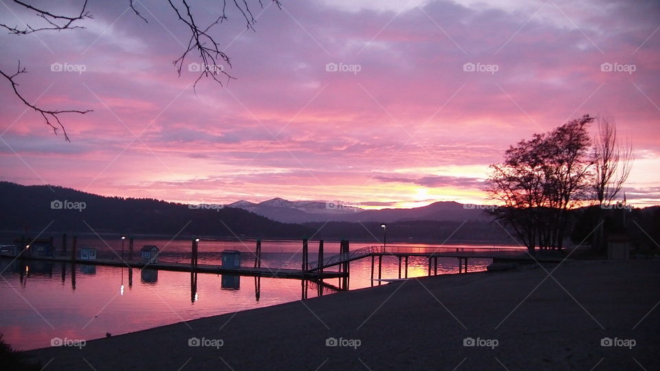 View of pier over lake during sunrise