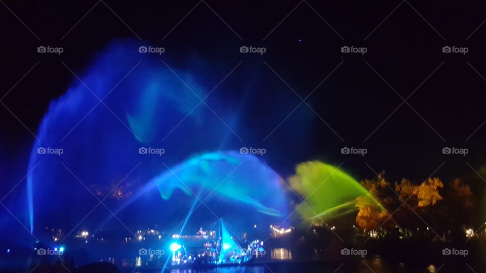 The mist lights up the sky above Discovery River during Rivers of Light at Animal Kingdom at the Walt Disney World Resort in Orlando, Florida.