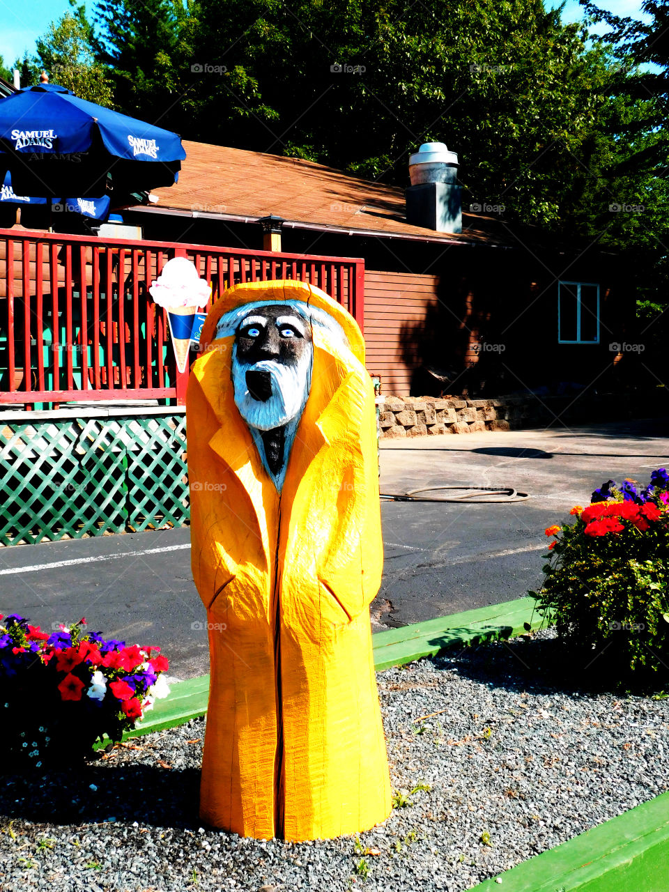 Old man of the sea with yellow rain coat