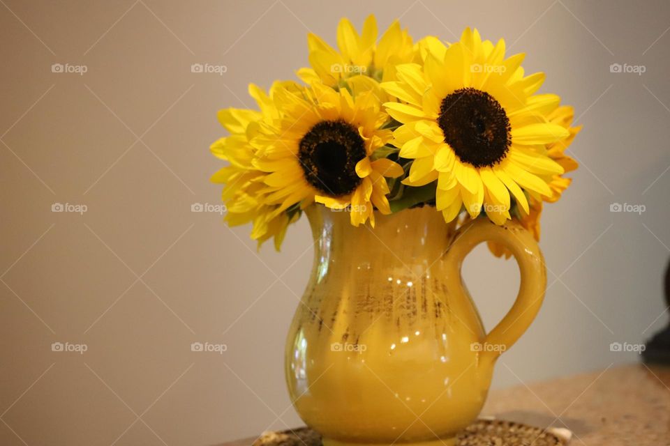 Sunflowers in a yellow vase