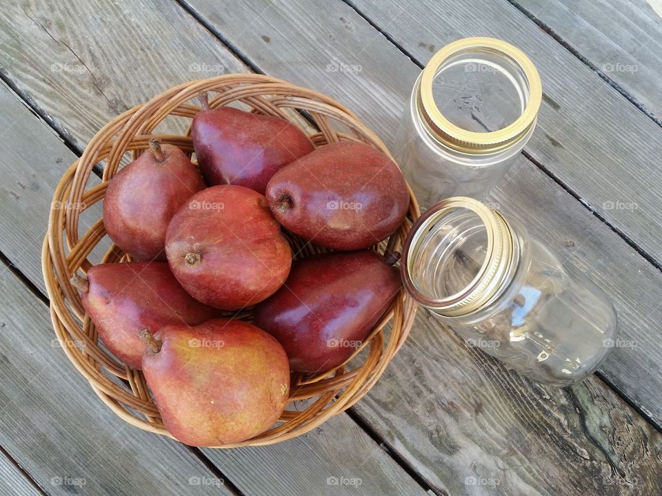 High angle view of pears fruit with empty jar