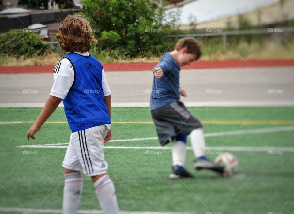 Kids Playing Soccer. Young Boys Playing Soccer
