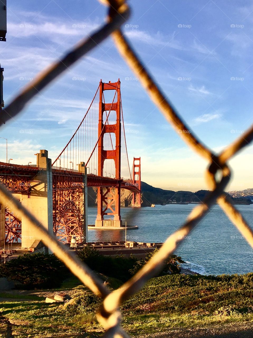 View of golden gate bridge through fence