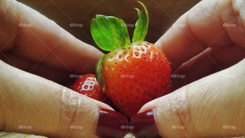 holding strawberry