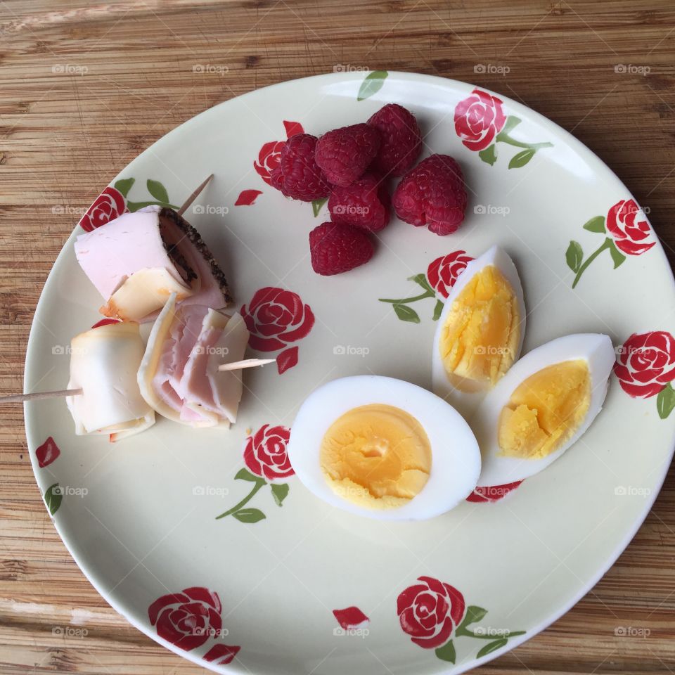 Raspberries boiled egg and launch and wraps