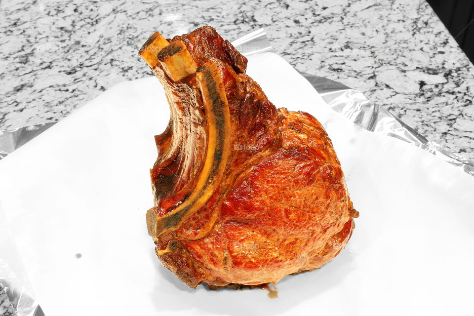 Ribeye roast cooked in barbecue smoker barrel