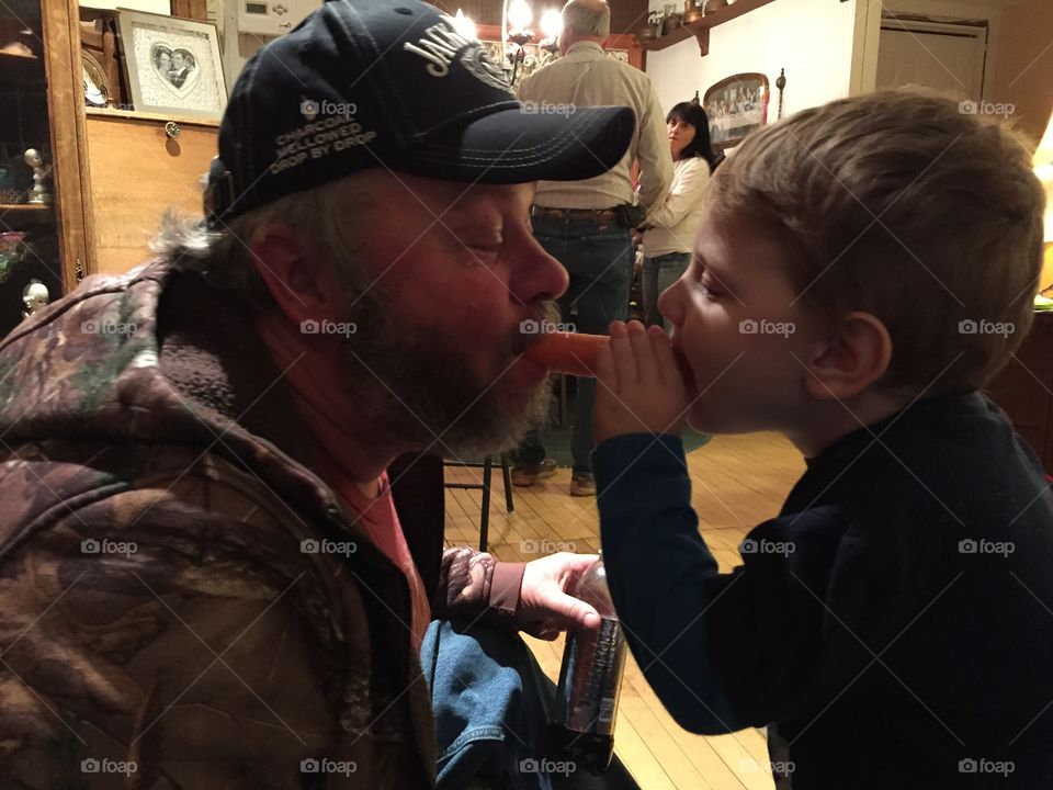 Sharing a carrot . Like the horses 