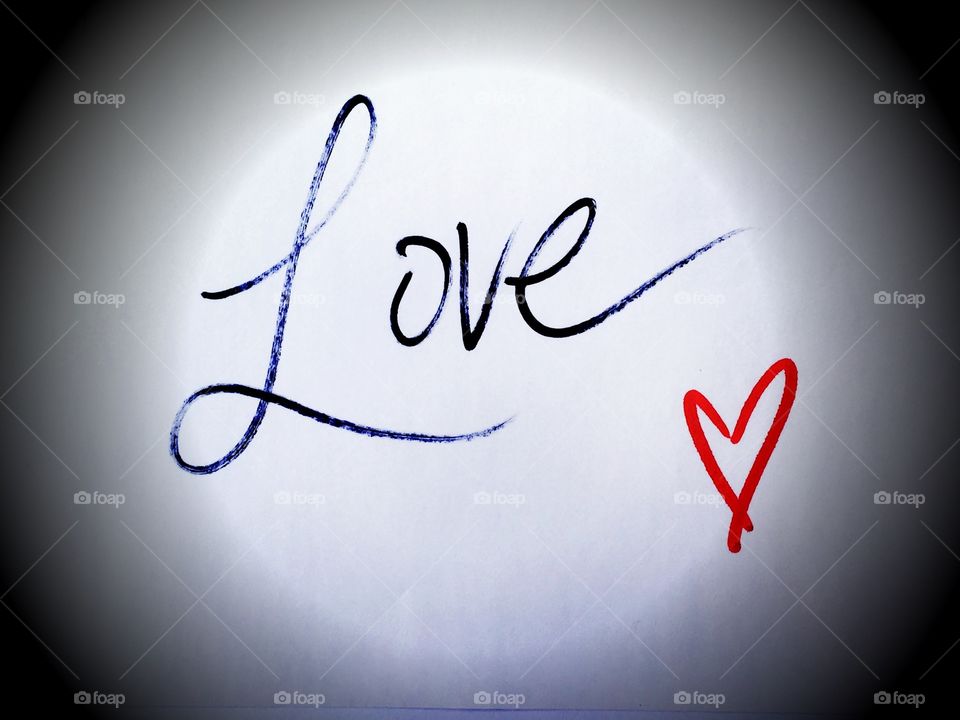 Love in cursive handwriting with heart