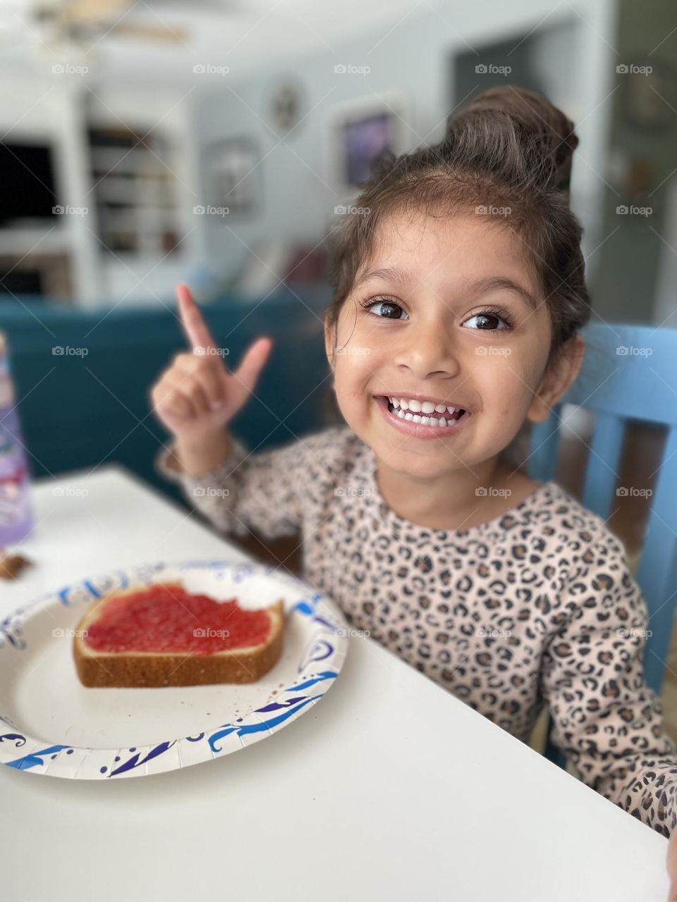 Little girl excited about jelly in bread, eating jelly on bread for lunch, delicious homemade jams, eating fresh produce 