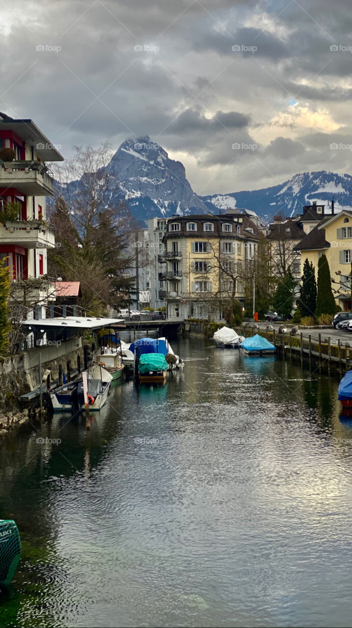swiss alps, stream, water, houses, ditch, boat at the pier,