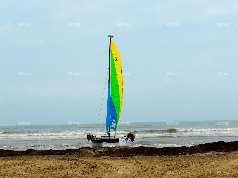 Set sail. Sailboat on shore on beach