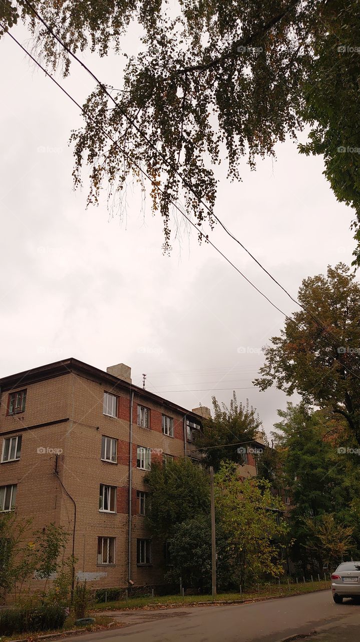 Autumn on the street, old apartment building