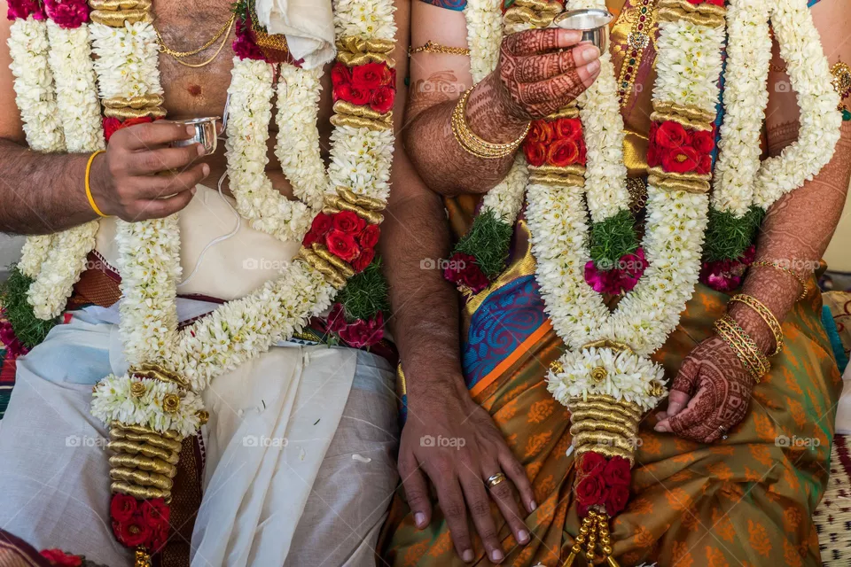 A colourful Indian wedding moment between interracial bride and groom. 