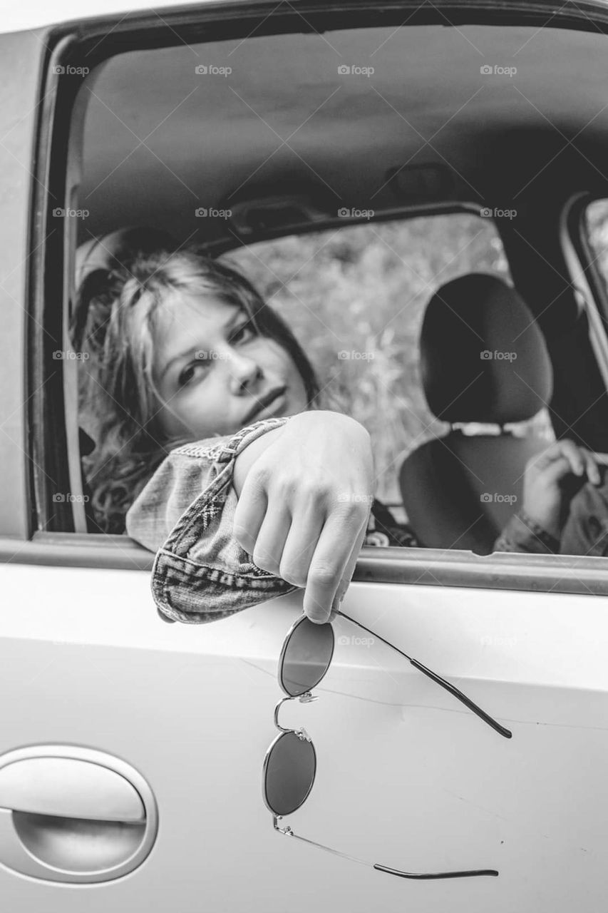 young blonde woman in a car