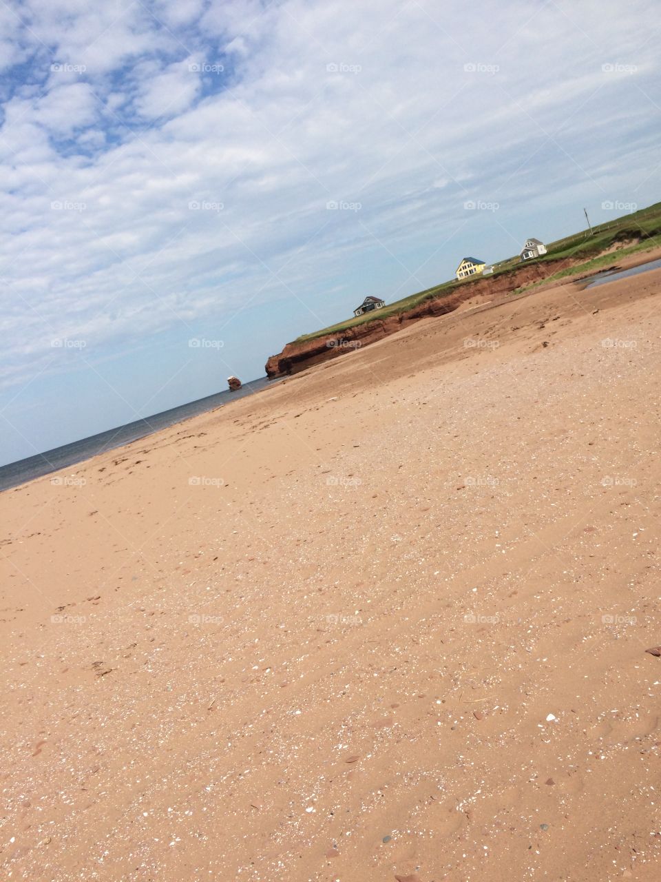 A perfect view of one of Prince Edward Island's best beaches with it's fine red-hued sand and flawless shore. 