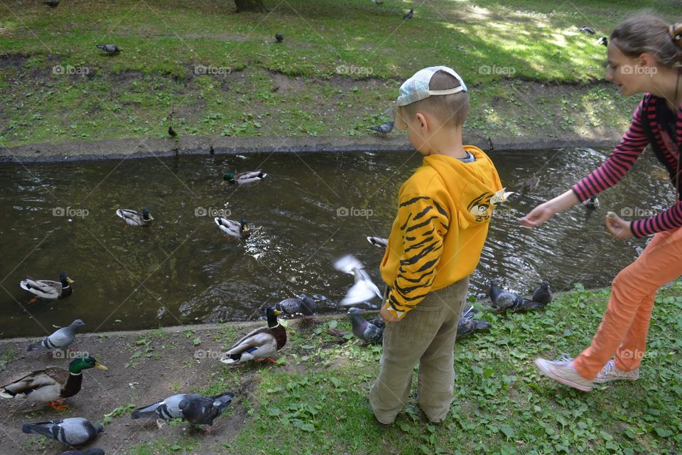 children on a urban city river