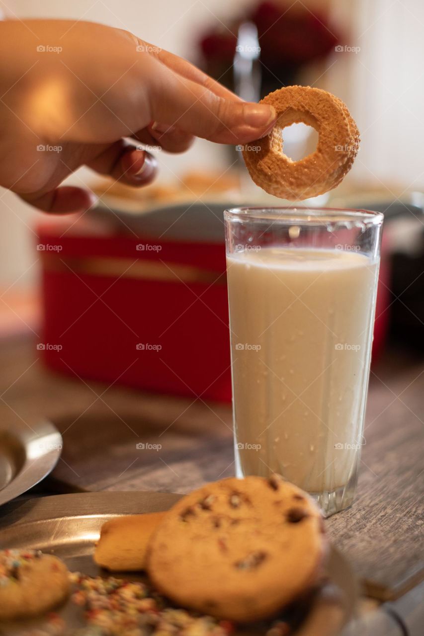 Droplet of a milk , cookies and a glass of a milk