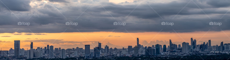 Panorama view of cloudy above skyscraper scape in Bangkok