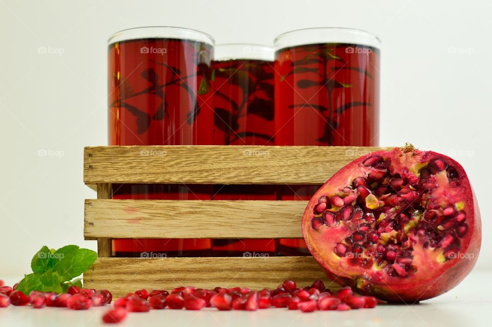 three glasses with pomegranate juice